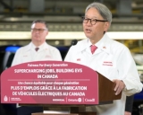  Jean Marc Leclerc, president and chief executive of Honda Canada, looks on in the background as Toshihiro Mibe, president and chief executive of Honda Motor, speaks to the crowd at Honda of Canada manufacturing.